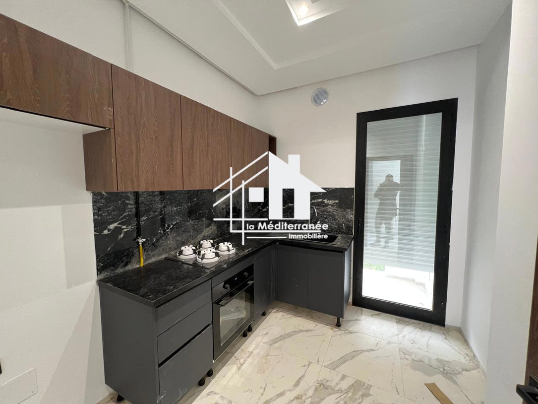A vendre un s+1 neuf avec jardin aux jardins de carthage