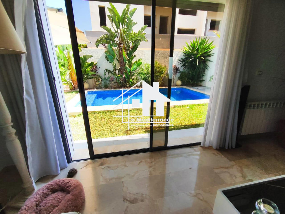 A vendre une superbe villa jumelée avec piscine et jardin