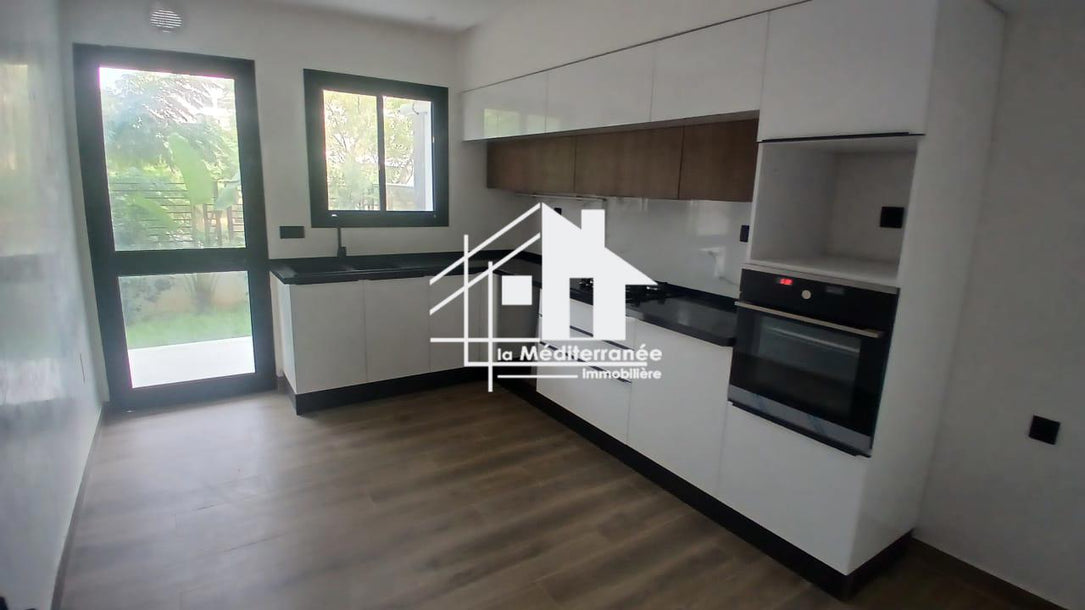 A vendre un appartement S+3 RDC a jardin de carthage