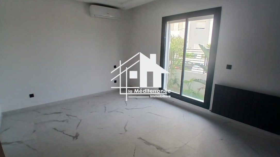A vendre un appartement S+3 RDC a jardin de carthage