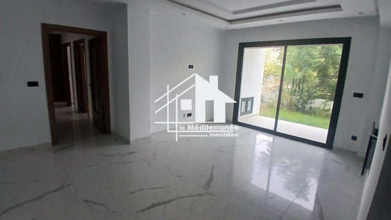 A vendre un appartement S+3 RDC a jardin de carthage
