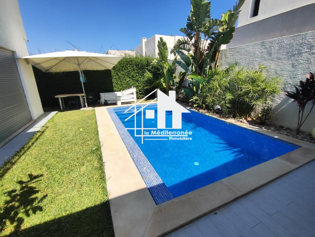 A vendre une superbe villa jumelée avec piscine et jardin