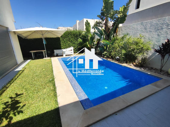 A vendre une superbe villa jumelée avec piscine et jardin