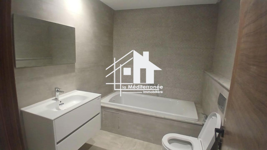 A vendre un appartement S+3 RDC a jardin de carthage