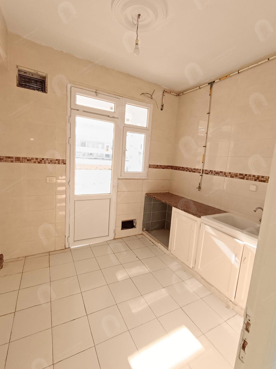 à vendre un appartement au RDC