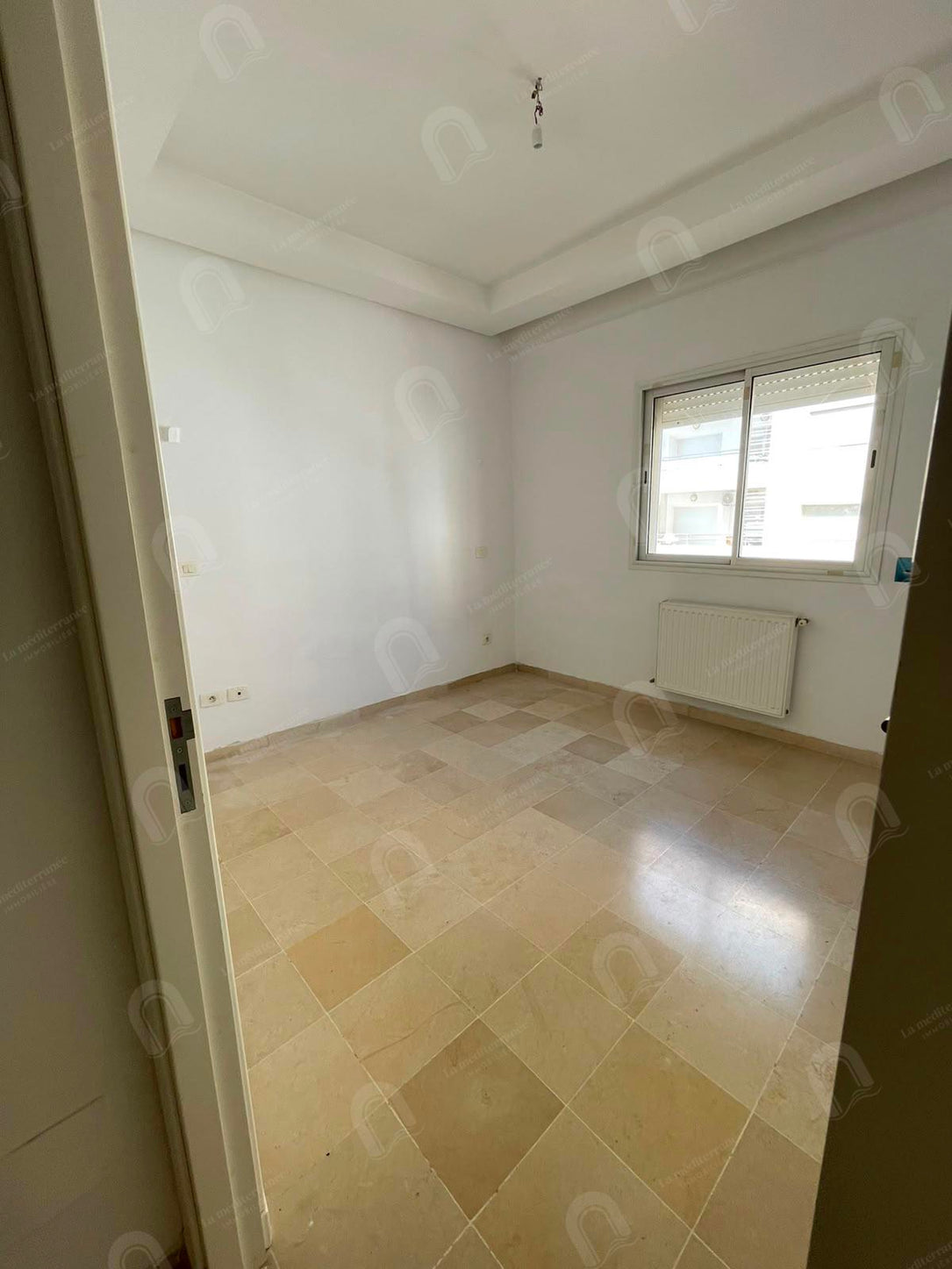 a vendre  un appartement s+2  jardin el menzeh 2