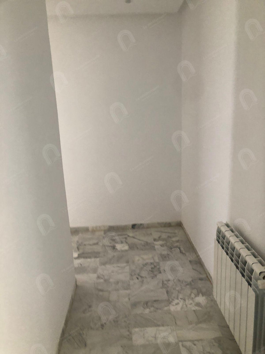 a louer un apratement s+3 a cité Enasser